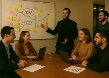 Team working together to align technical design with product vision during a whiteboard session.